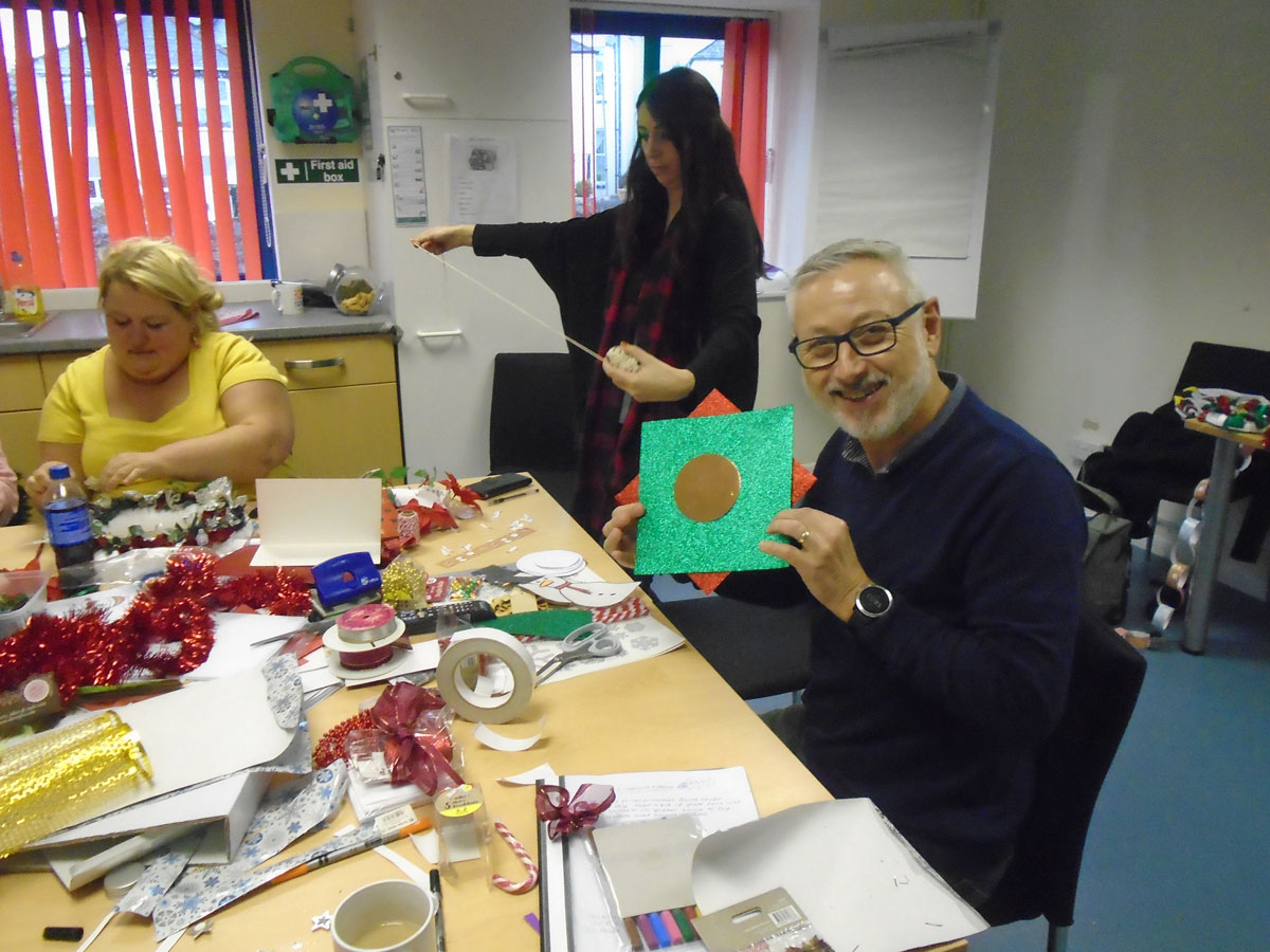 Photo of people making Christmas decorations